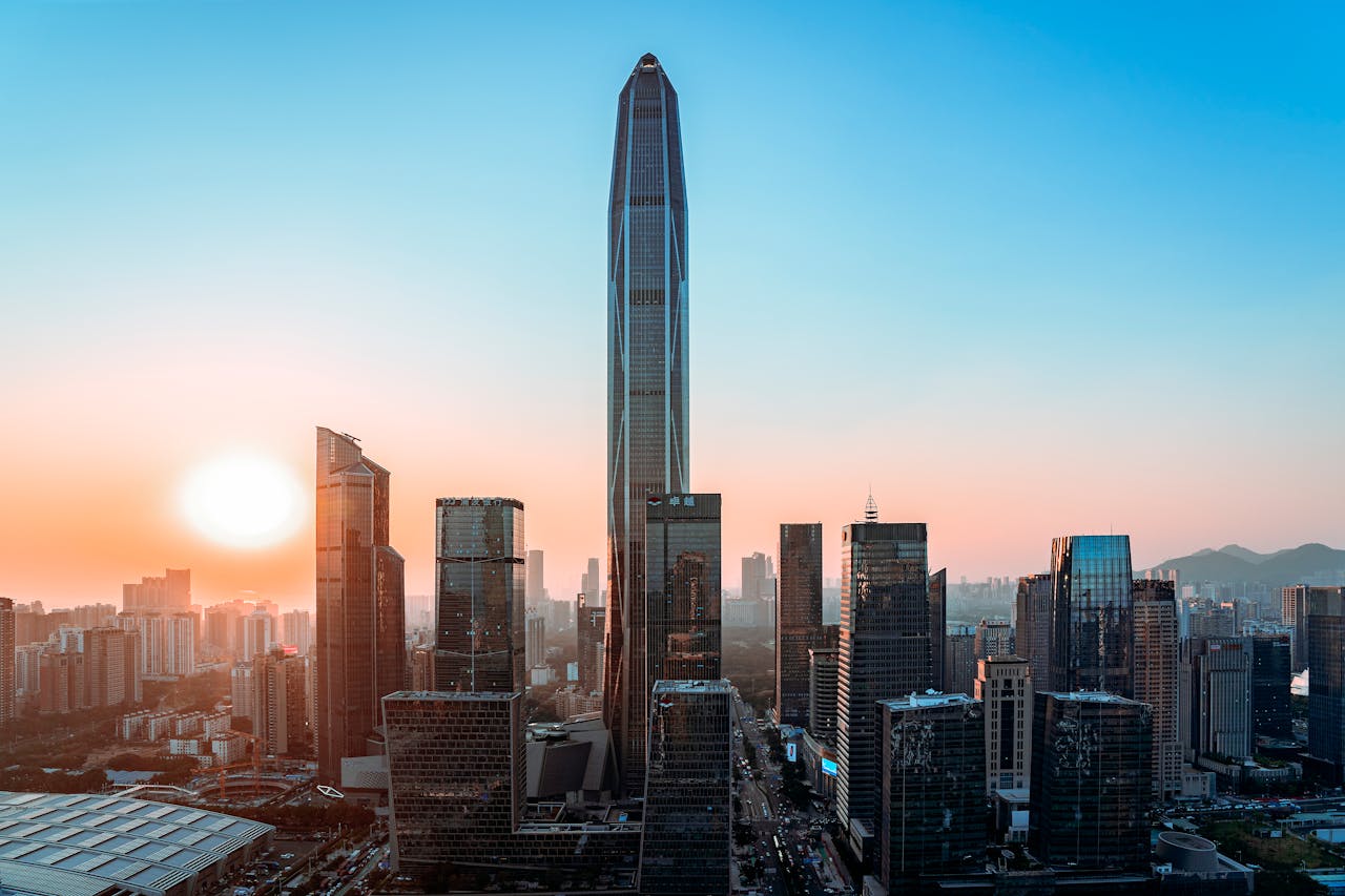 Blog Vibrant Shenzhen skyline with tallest buildings at sunset, showcasing urban development.